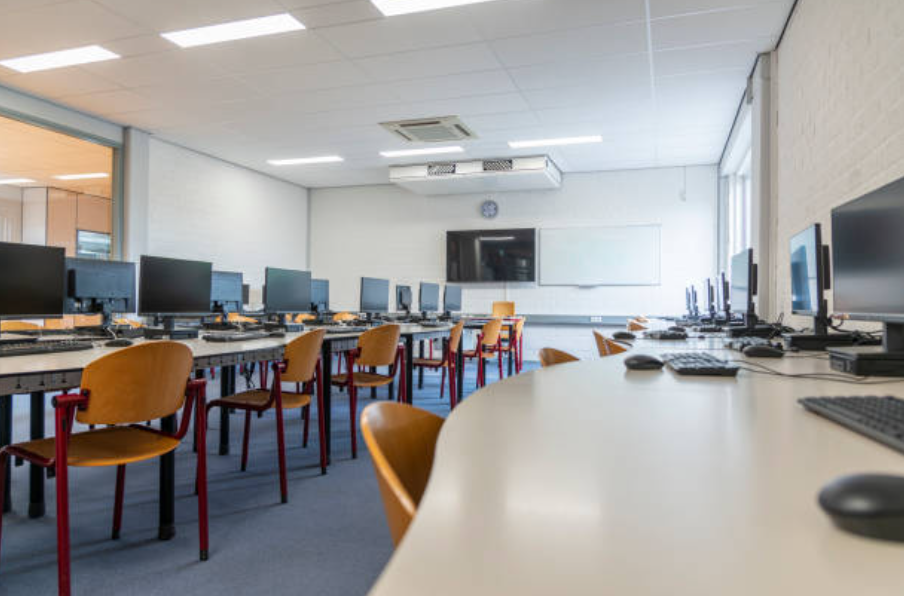Students learning technology in a modern computer lab